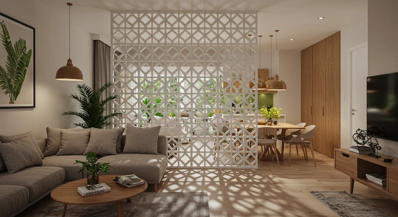Ambiente moderno com espaços integrados e parede de cobogó branco separando sala de estar e sala de jantar, permitindo passagem de luz natural e mantendo sensação de amplitude.